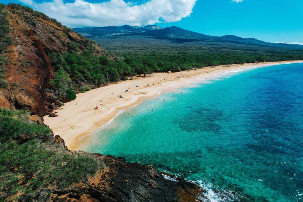 shutterstock 2087367667 Big Beach Maui Hawaii tropical beach blue sky white clouds green sea