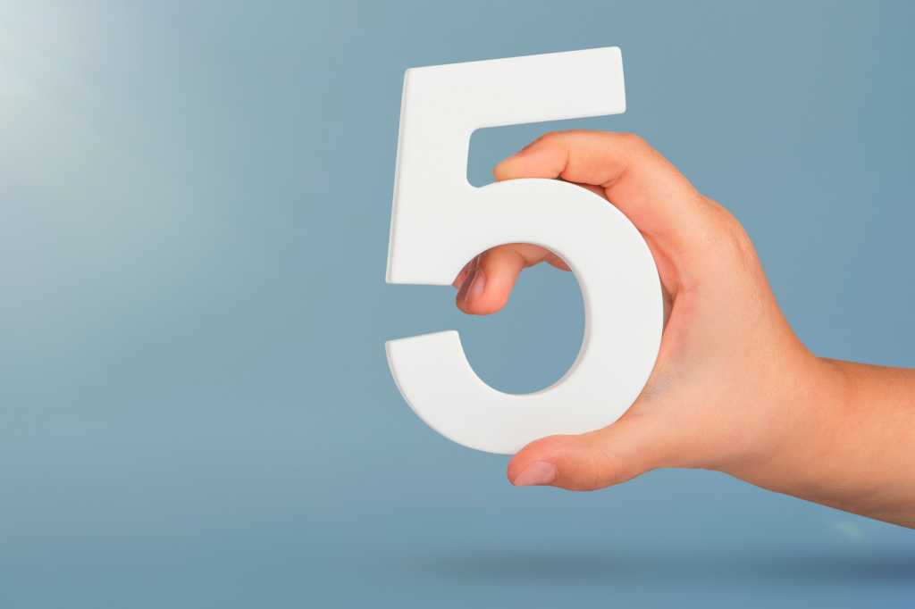 Five, 5, a person's hand holding the number 5