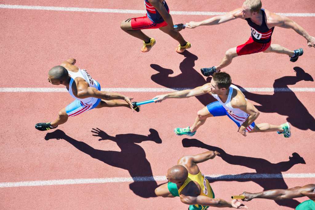 Distributed programming, collaboration, relay. Runners on a track.