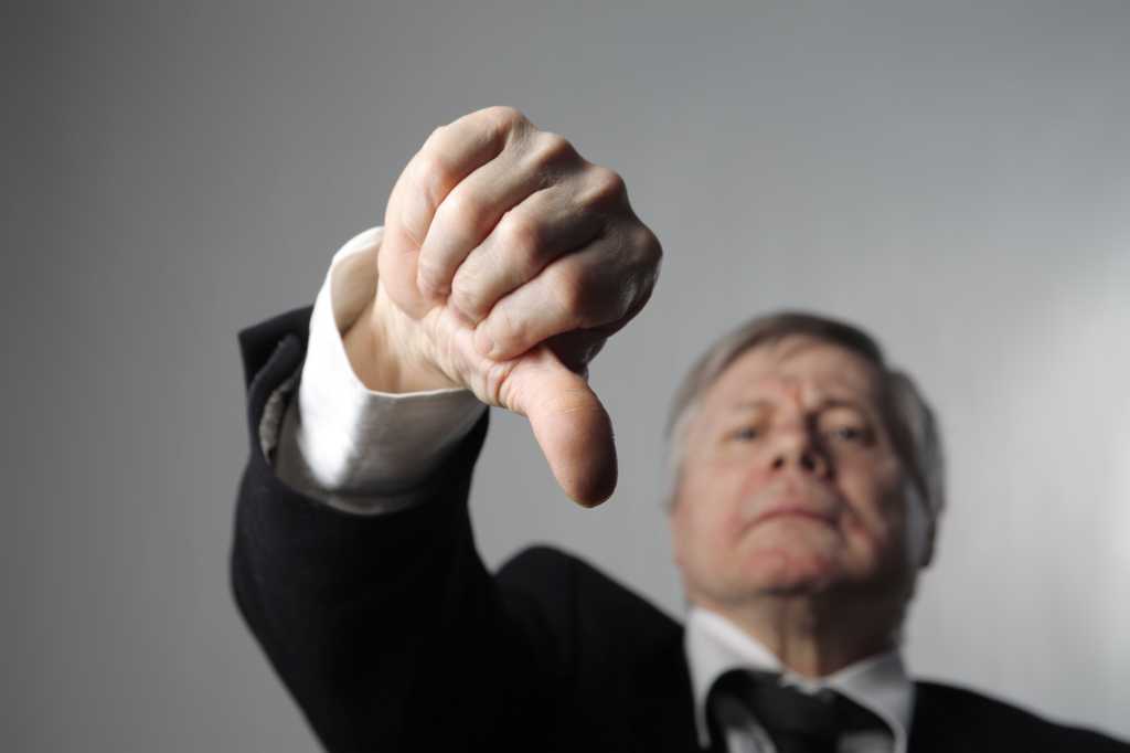 shutterstock 26147695 a businessman with thumbs down