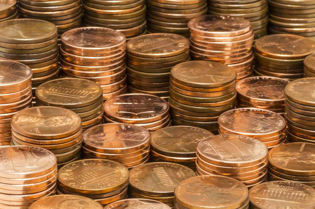 penny stacks of shiny copper pennies money