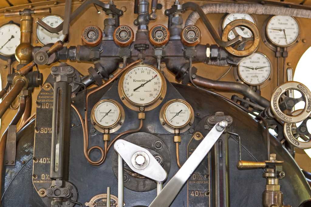 shutterstock 61529212 engine room steam pipes and dials of steam locomotive