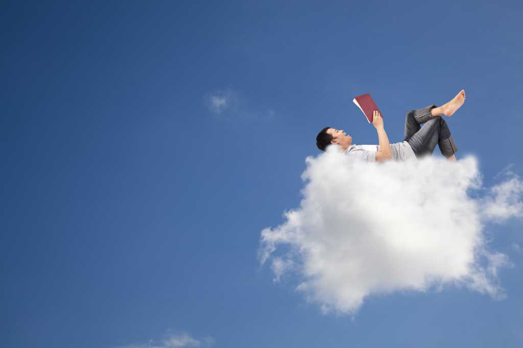 Easy, cozy. Image of a man resting on a cloud.