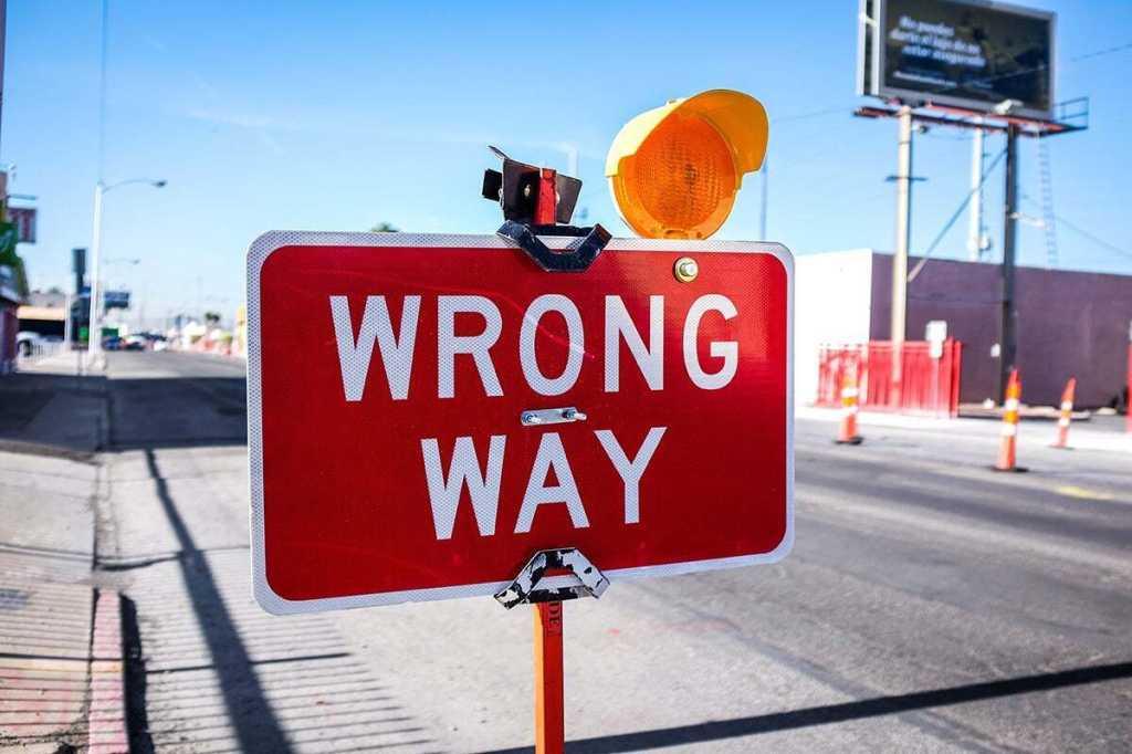 wrong way road sign neonbrand cc0 via unsplash 1200x800